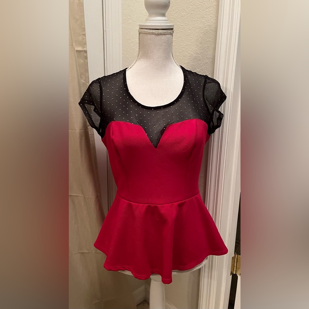 Cute, red, black, sheer, neckline adorned with gold dots. Shows your finger!